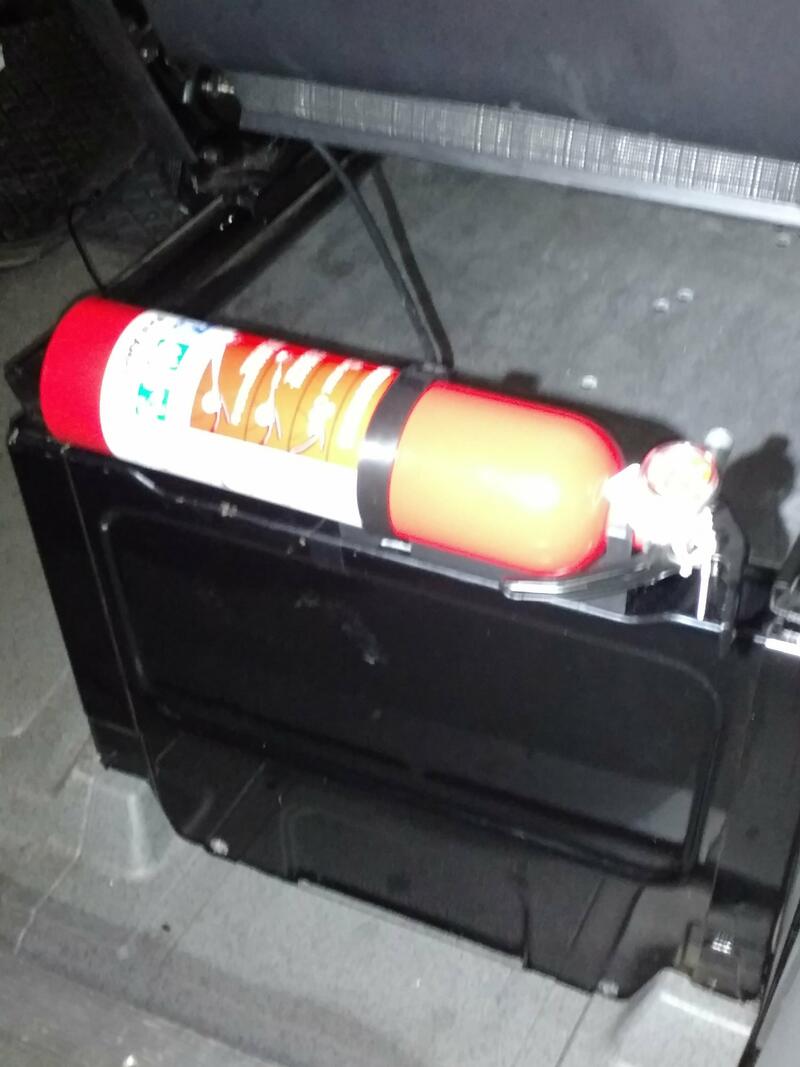 Sprinter Discovery Vanlife Photo Fire Extinguisher with seat pushed all the way forward